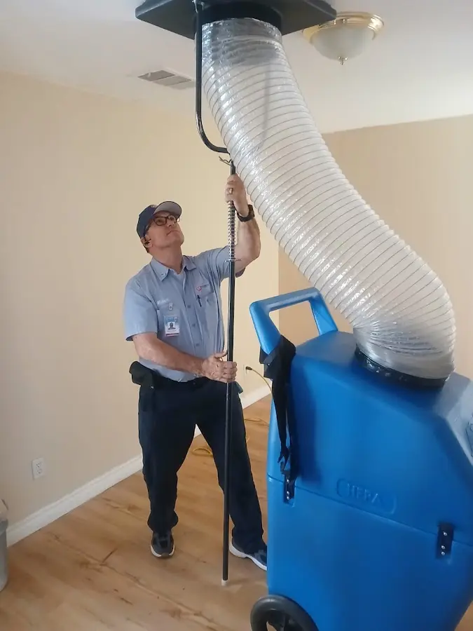 Furnace Tune-Up technician using HEPA equipment in Harrisburg